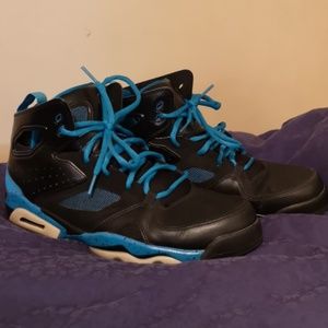 black and turquoise jordans